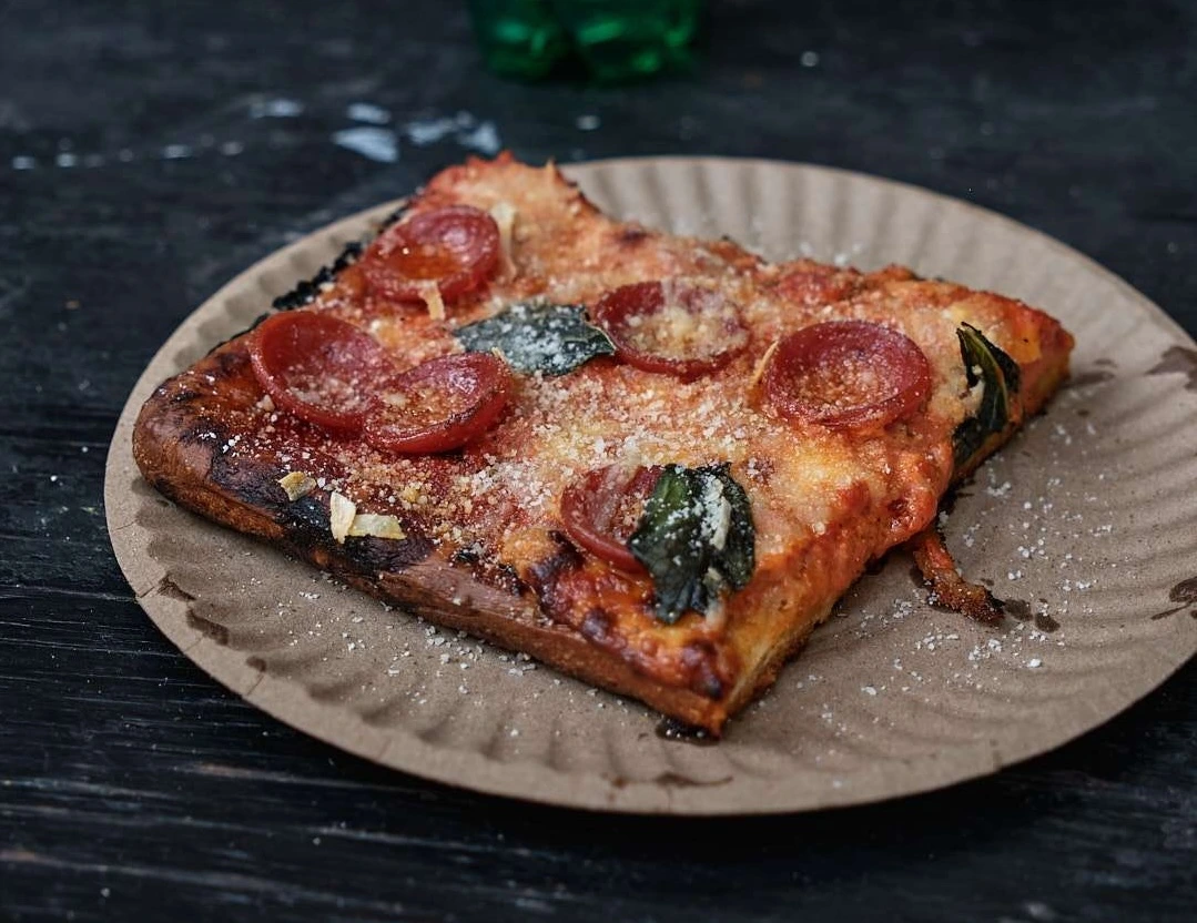 person eating pizza